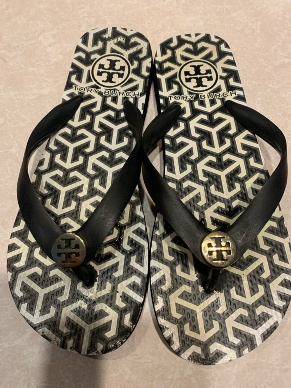 Tory Burch Black and White Logo Pattern Flip Flops it seems to be a 7 not sure